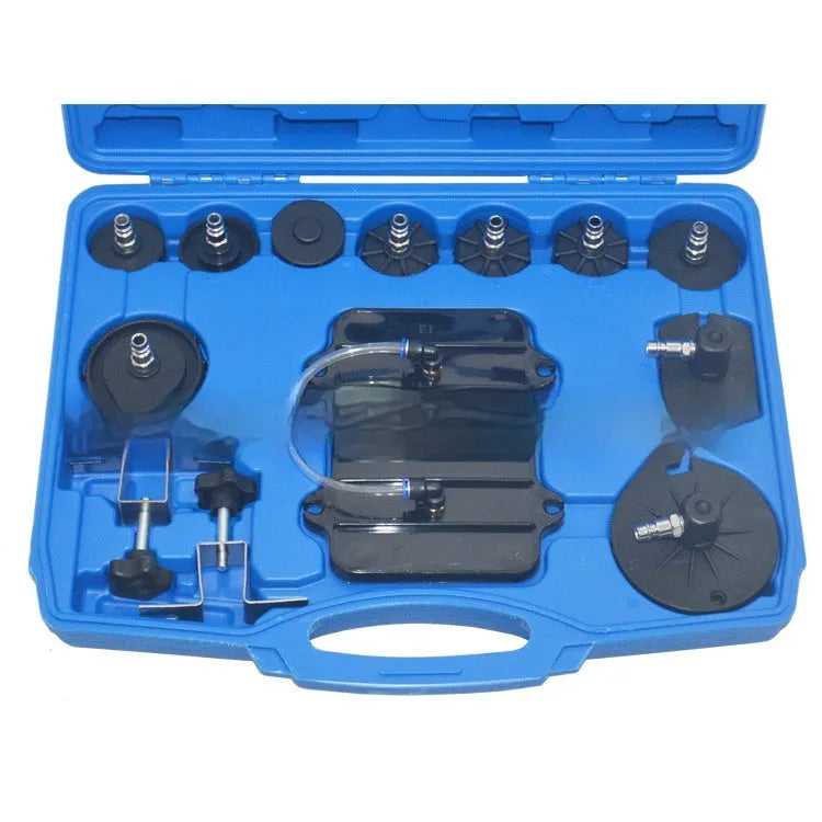 Pneumatic brake fluid replacement tool with 5L tank, pressure gauge, adapter kit, collection bottle, and fluid hose on a workbench