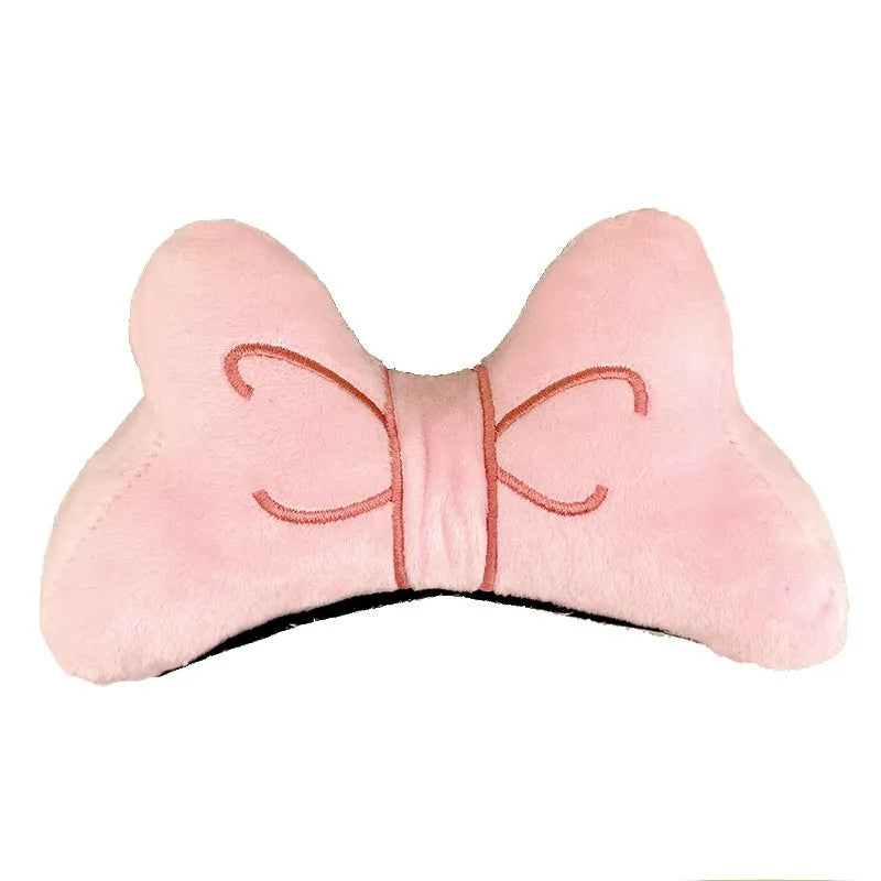 Soft plush bow helmet decoration for motorcycle and ski helmets in red or pink colours.