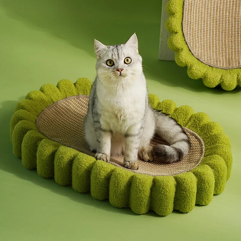 Green oval cat scratching pad with sisal surface measuring 65cm long, functioning as both scratcher and lounger bed