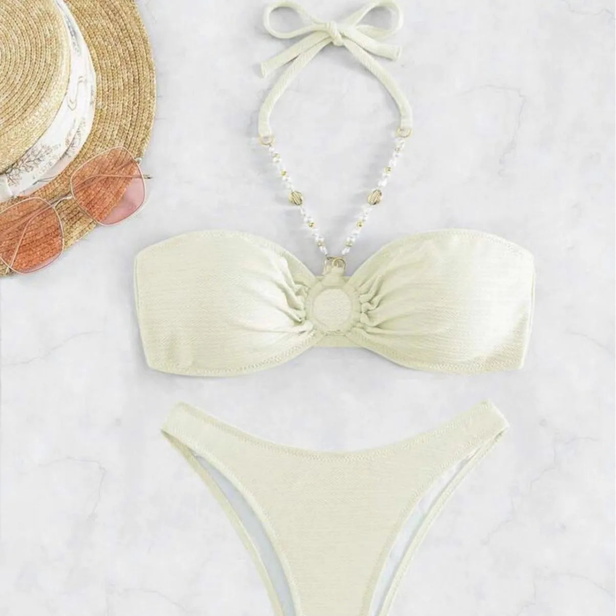 Women's solid colour halter neck bikini set on a white background, shown in creamy-white.