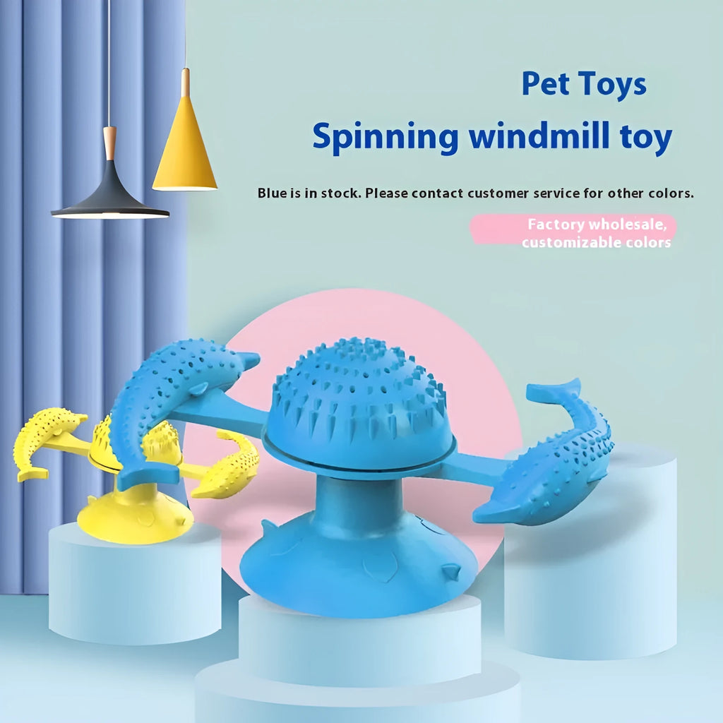 Blue rubber turning windmill cat toy on floor, designed for interactive boredom relief play