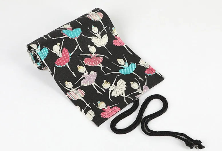 Square canvas pencil case with ballet girl print, showing elastic loops inside for organising pencils.
