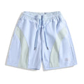 Black and grey quick-drying sports shorts with elastic waistband and loose straight-leg design