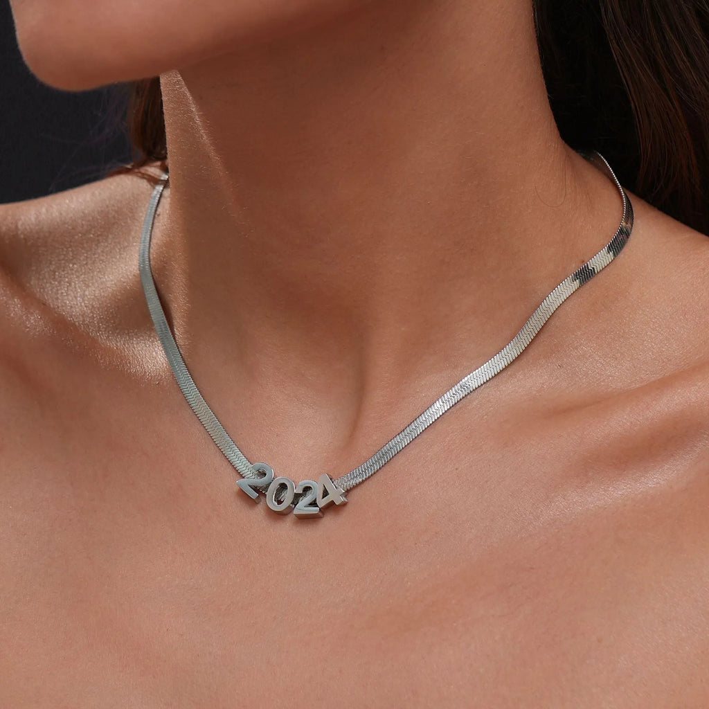 Gold titanium steel necklace with letter A charm on a 40.5cm chain.