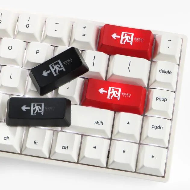 Transparent mechanical keyboard key cap with raised safety evacuation exit text