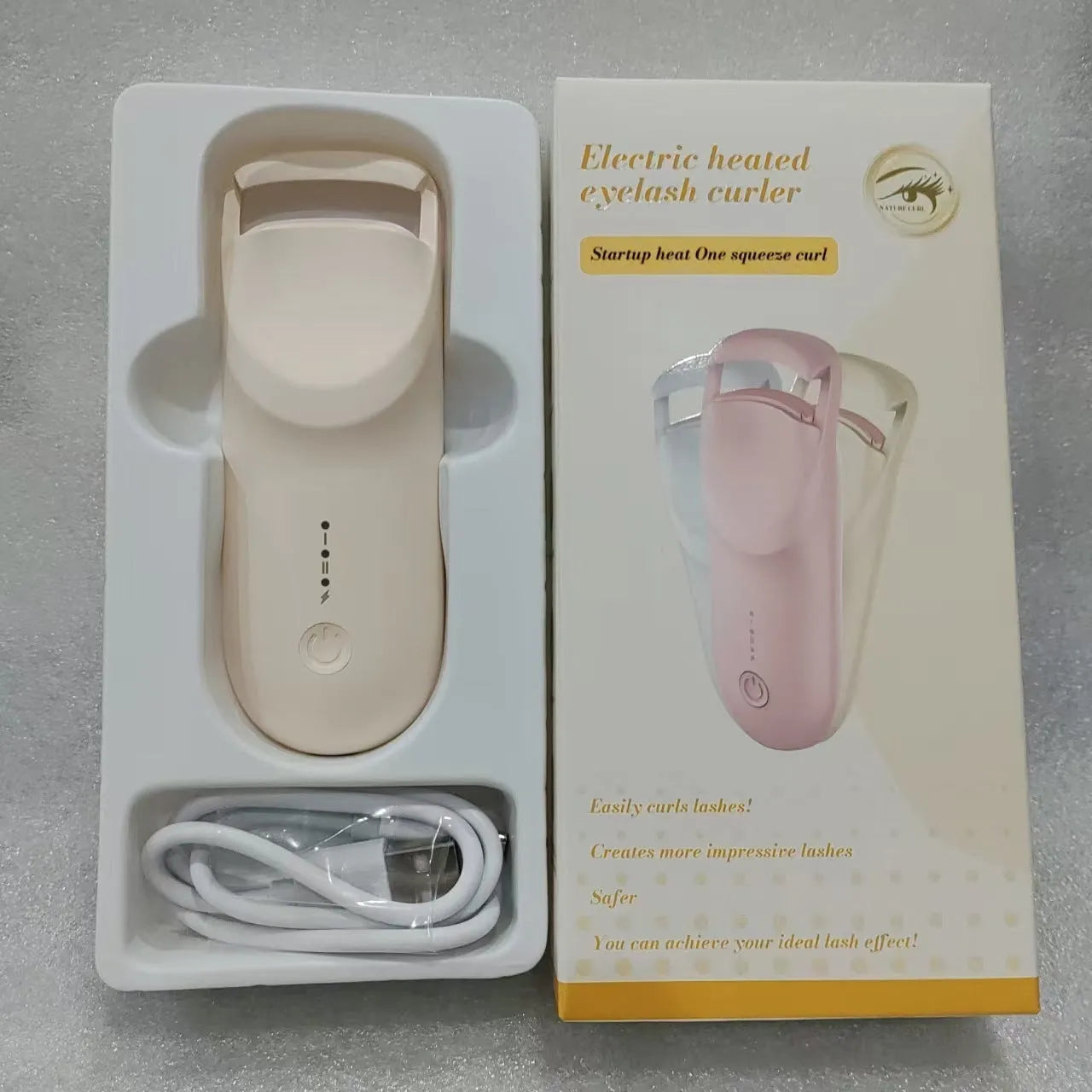 Electric eyelash curler with USB charging cable in cream white, maca pink or vanilla apricot colour options