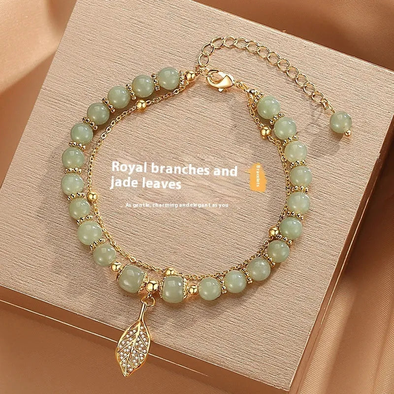 Chinese style bamboo leaf glass bracelet for women with a bamboo joint design.