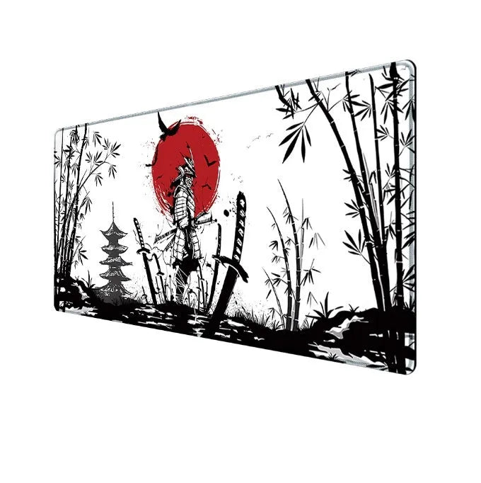 Japanese samurai design gaming mouse pad with cloth surface on a desk.