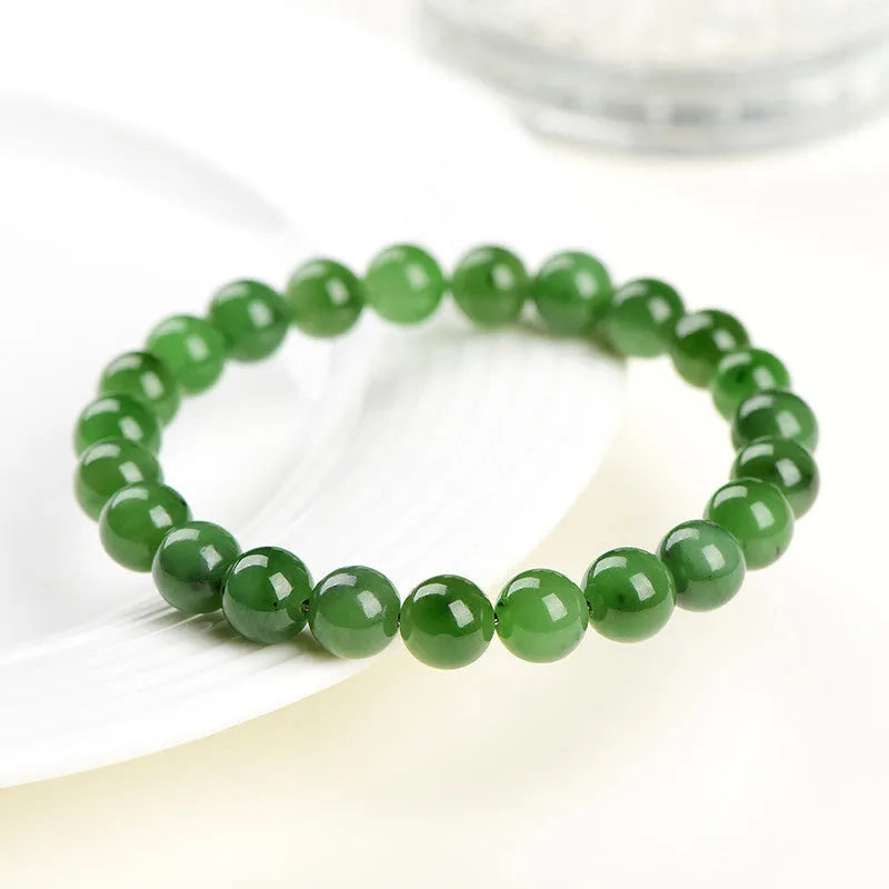 Polished Hetian jade bead bracelet in jasper colours, shown in various bead sizes on a wrist.