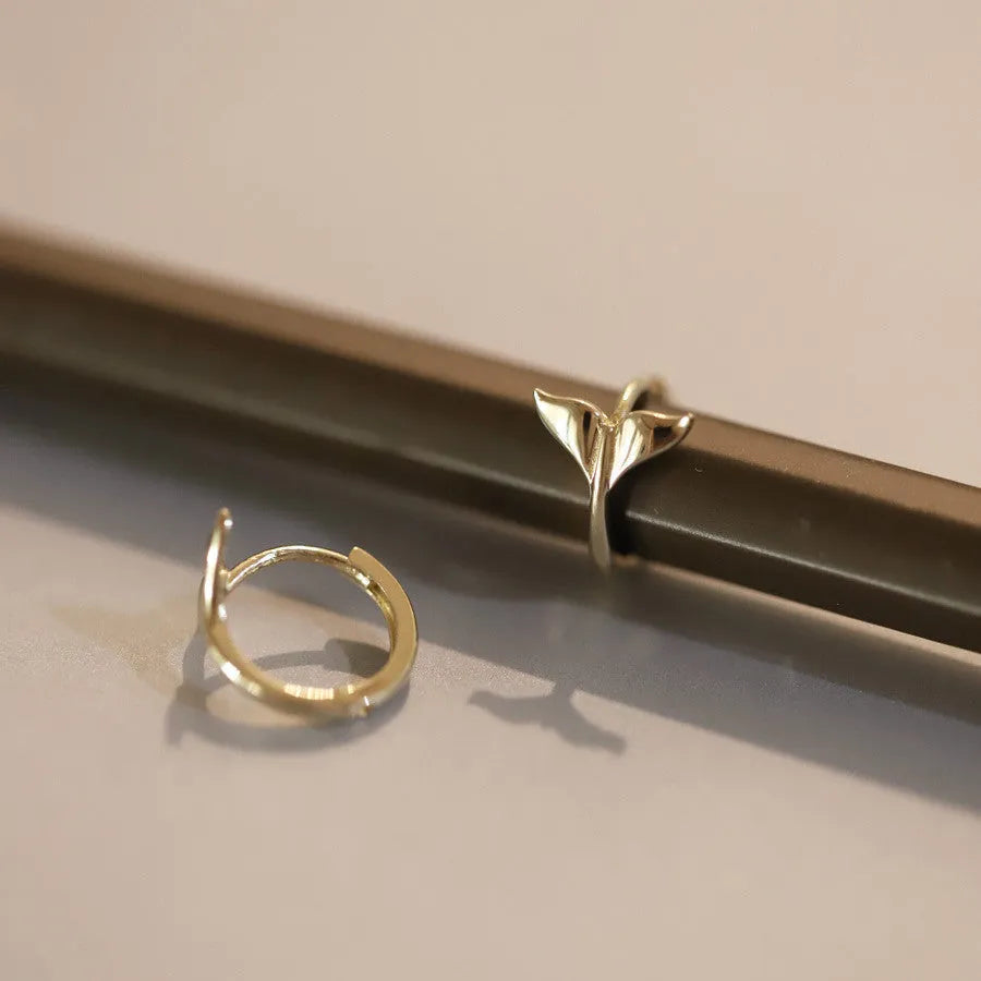 Gold plated sterling silver fishtail earrings with smooth finish and 8-10mm diameter.