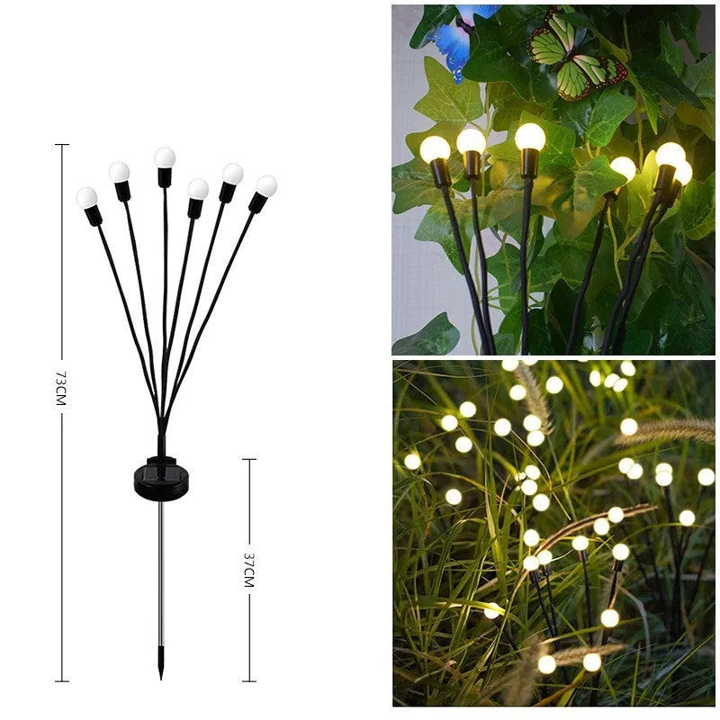 Solar-powered LED garden ground light with multiple heads and a stainless steel stake inserted into soil.