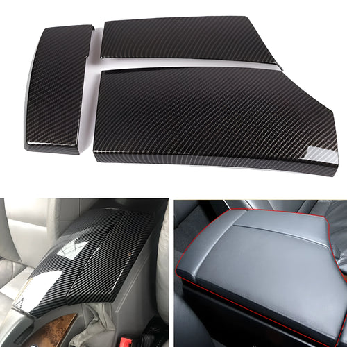 Three black ABS protective covers with a diagonal carbon fibre pattern for a car armrest box