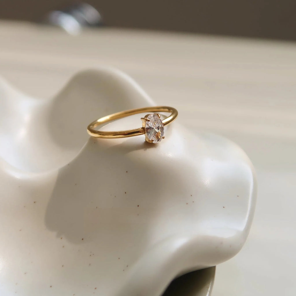 Golden stainless steel ring with either love heart or oval charm on simple band
