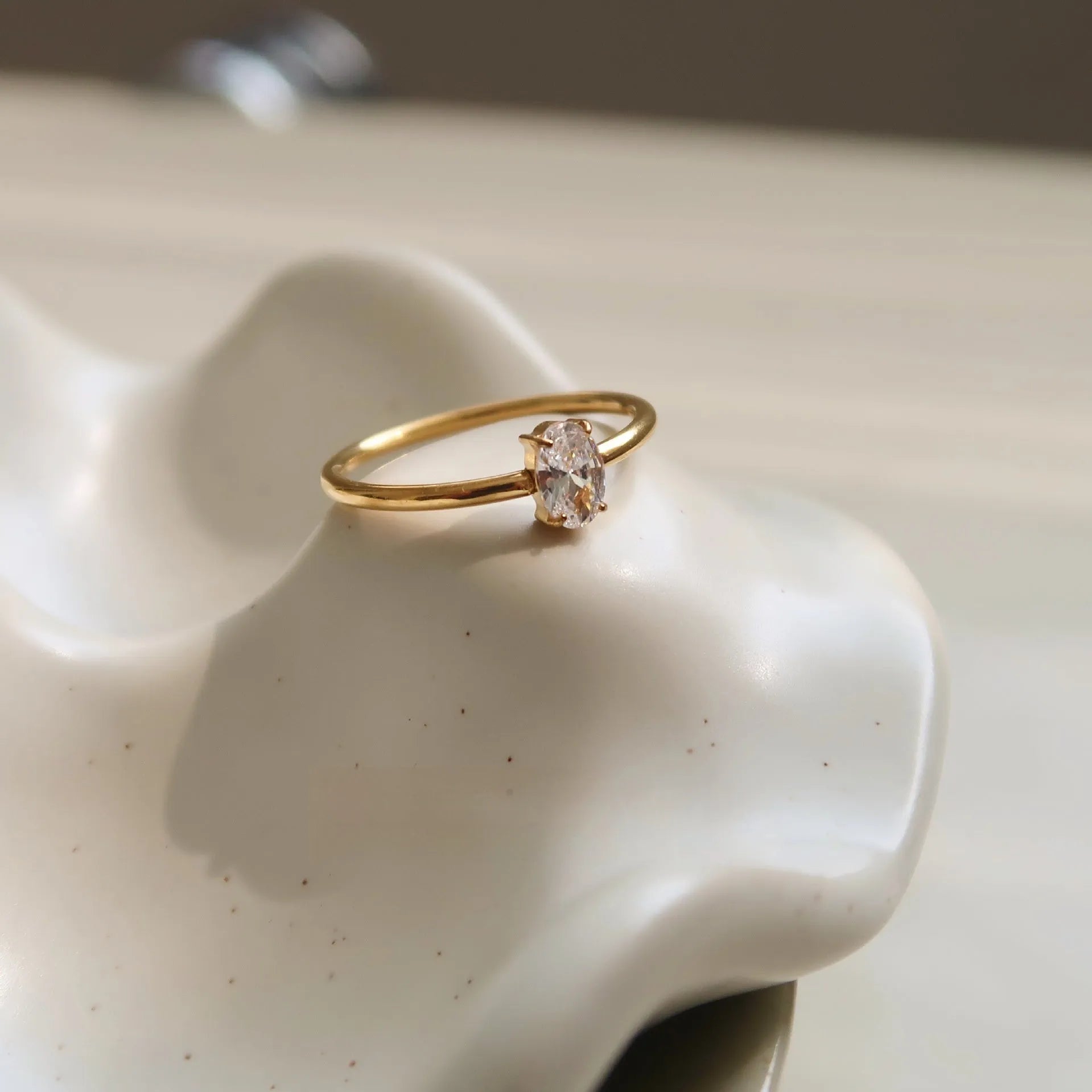 Golden stainless steel ring with either love heart or oval charm on simple band