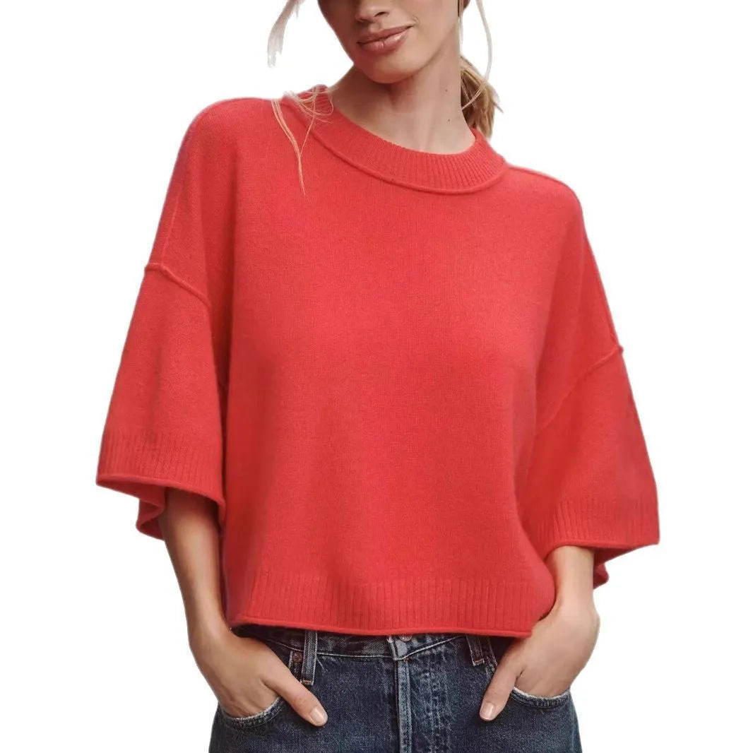 Red women's short viscose T-shirt with an exposed navel design on a model