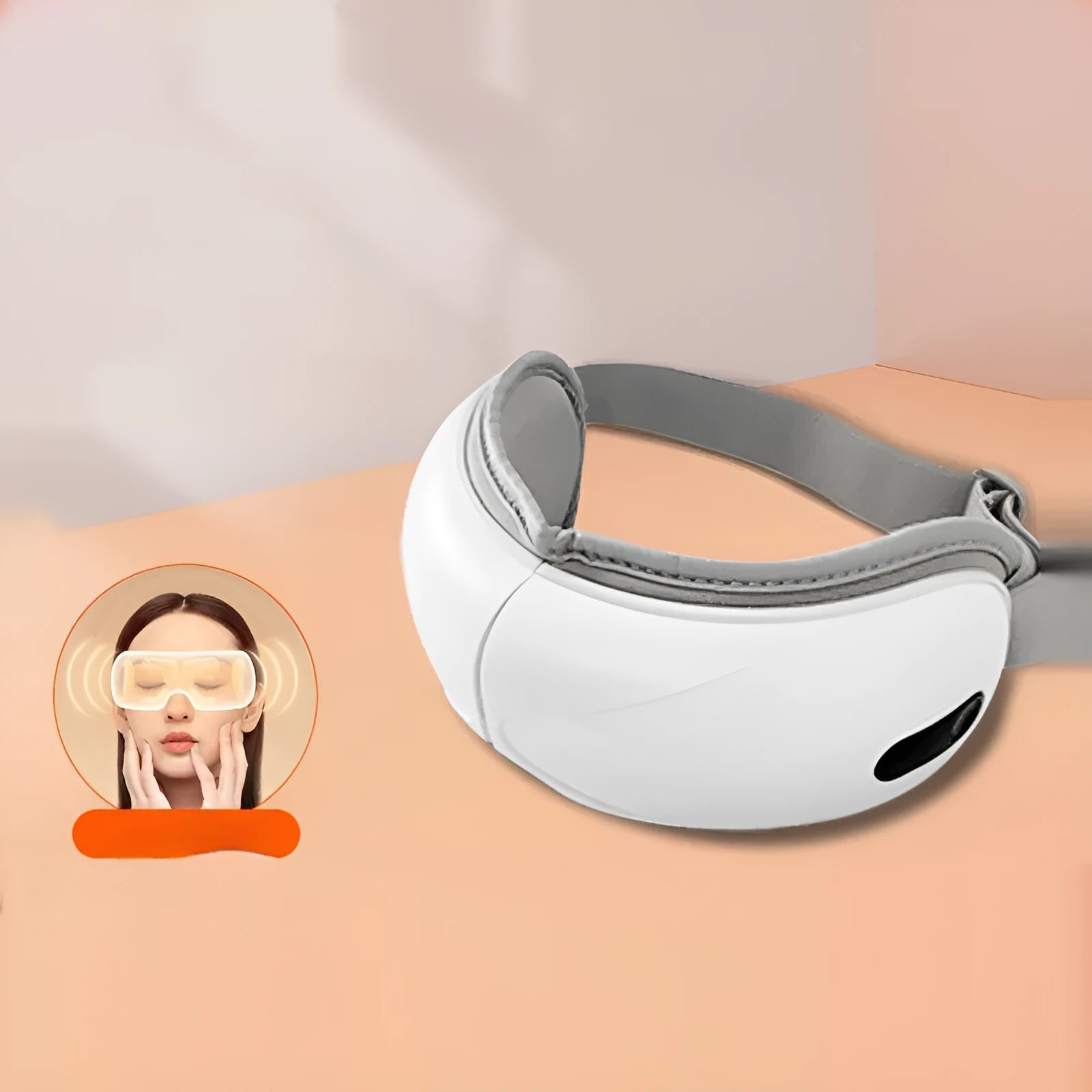 White rechargeable eye massager with airbag massage and hot compress functions on a plain background.
