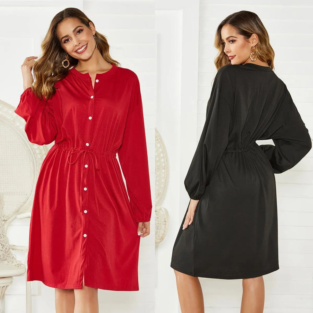 Women's black A-line dress with elastic waist, long sleeves, and a cinching belt on a mannequin.