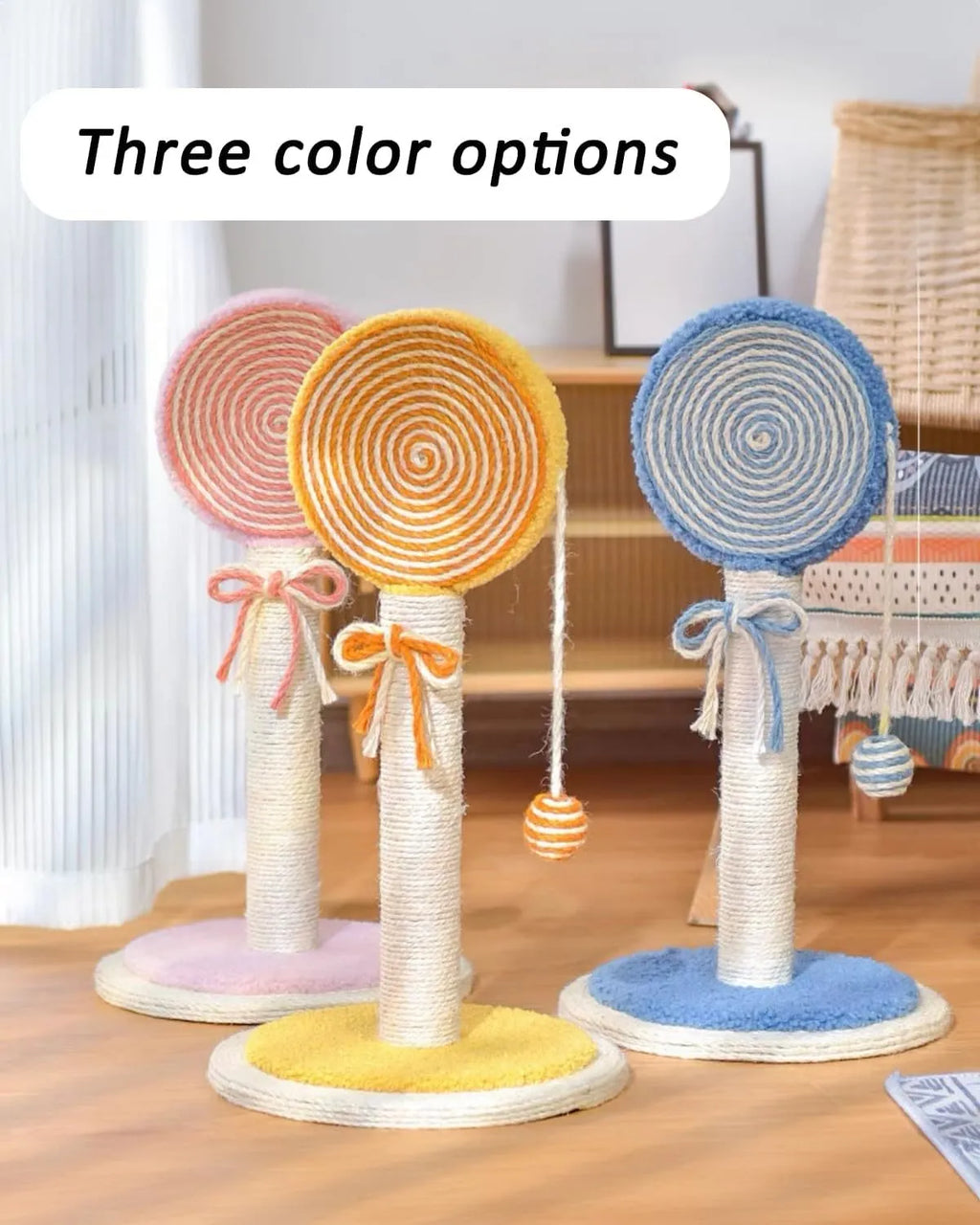 Blue cat scratching post with sisal rope centre and a hanging ball on a sturdy wooden base.