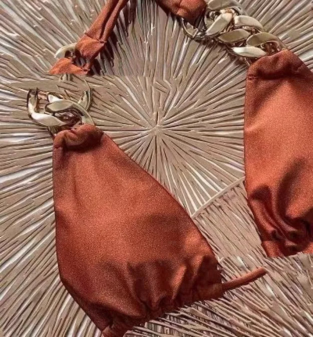 Brown women's tube-top push-up bikini swimsuit with ring tether and split bottom.