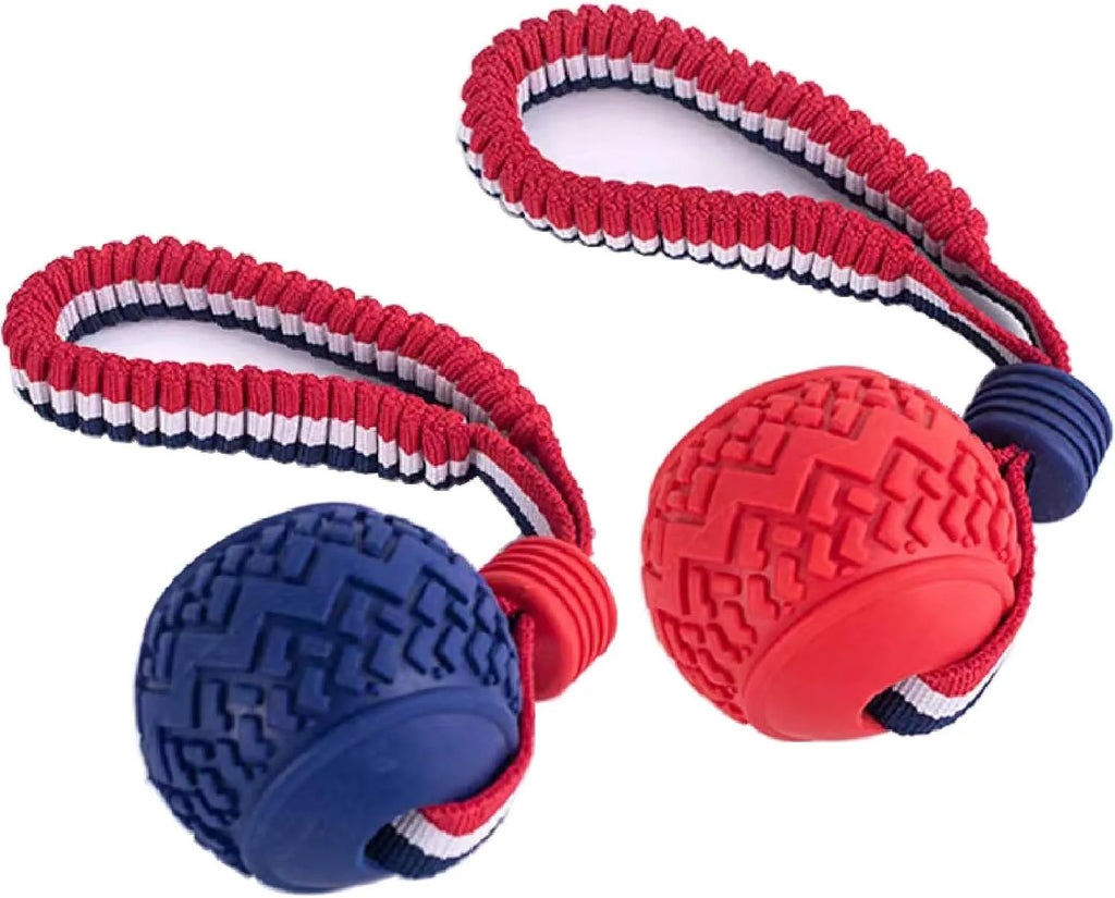 Blue or red natural rubber dog ball on rope toy measuring 29cm total length with 6.5cm diameter ball