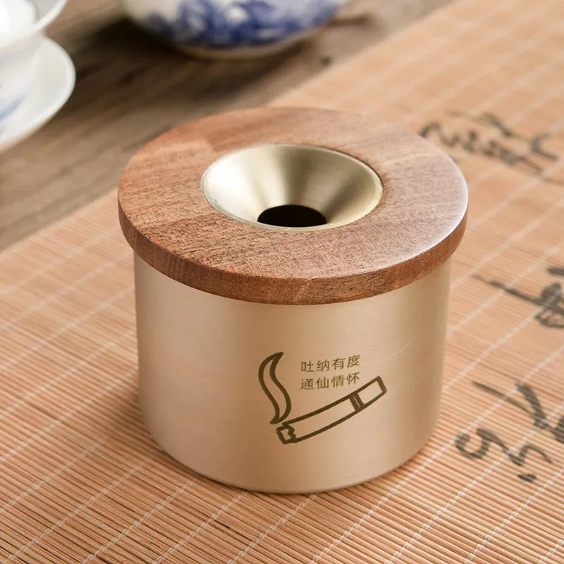 Retro brass-coloured copper ashtray with a wooden lid featuring a central hole