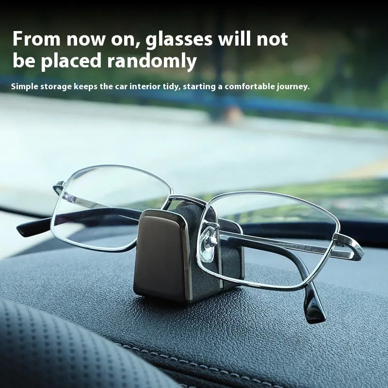 Compact zinc alloy and leather glasses clip for car dashboard, shown in available colours.