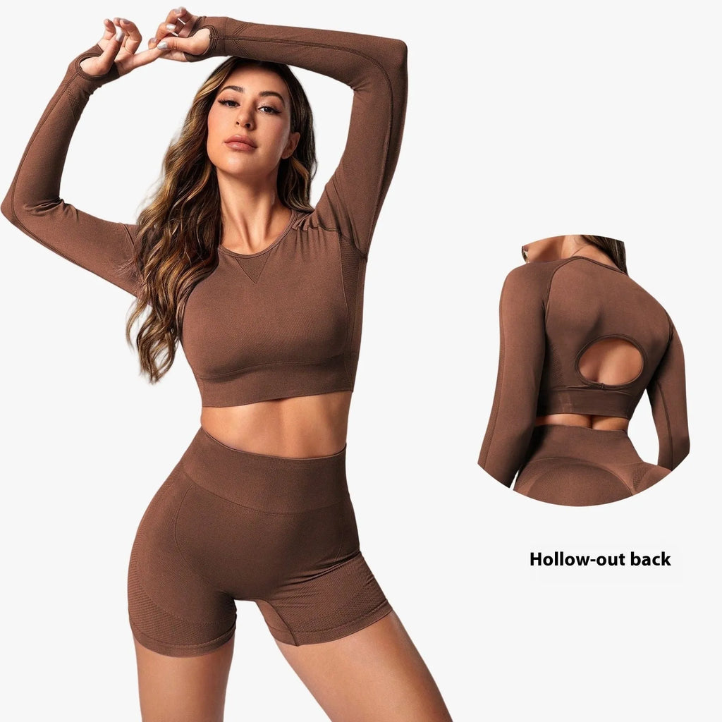 Women's black yoga suit with high waist pants and long sleeve pullover top for yoga practice