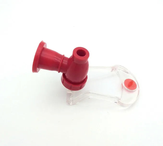 Red plastic Magic Tap soda bottle dispenser attached to a 2-litre bottle