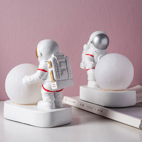 Gold resin astronaut night light on shelf, 14.5cm tall figurine with soft glow