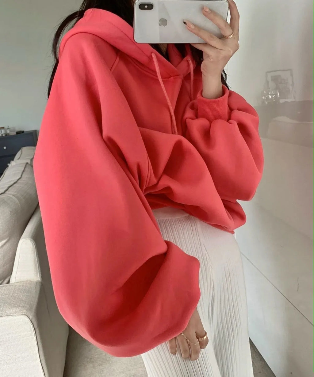 Women's watermelon red Mulberry Silk hooded sweater on a hanger, showing loose fit and front design.