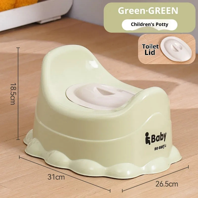 Children's small portable thickened toilet in Green with lid on white background