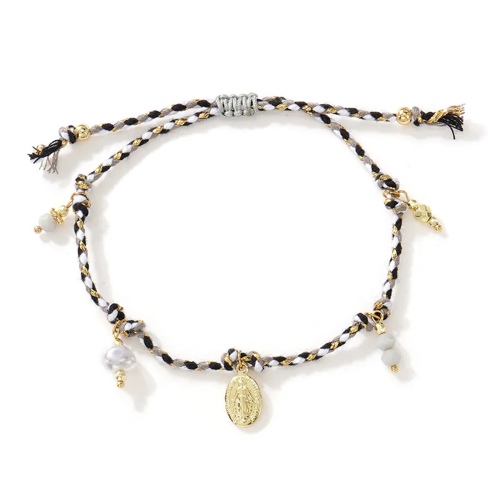 Ethnic style women's bracelet handmade from colourful braided rope with woven carrying strap tag design