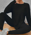 Women's black sunken stripe two-piece homewear set with a regular sleeve top and trousers.