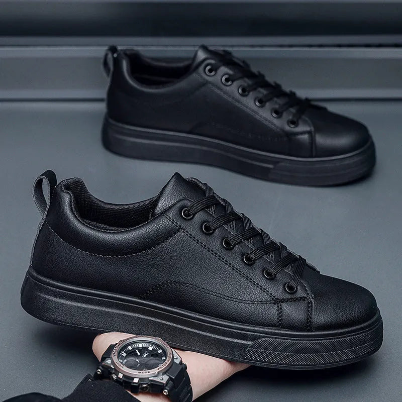 Men's low-top Korean-style casual sneakers in all black colour with a rubber sole.