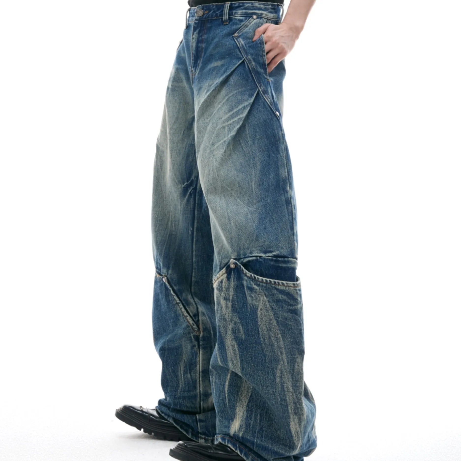 Men's verdant blue retro jeans with washed burst pattern and curved knife cut in loose fit