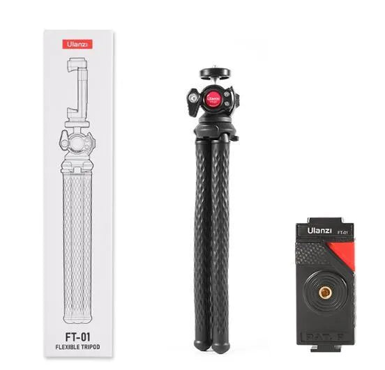 Black octopus leg mobile phone tripod with clip, extended to 360mm on a table.