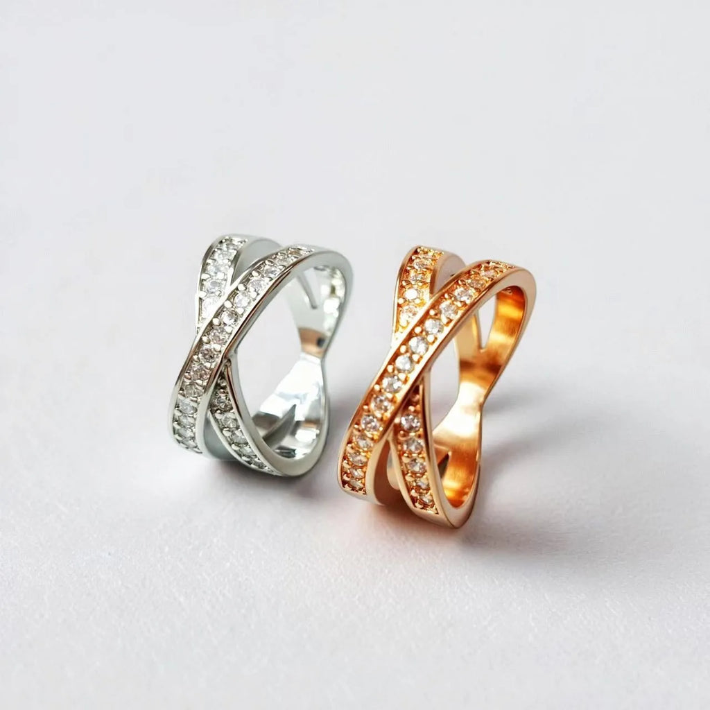 Silver or rose gold couple ring with micro-inlaid cross and geometric design on a copper band.