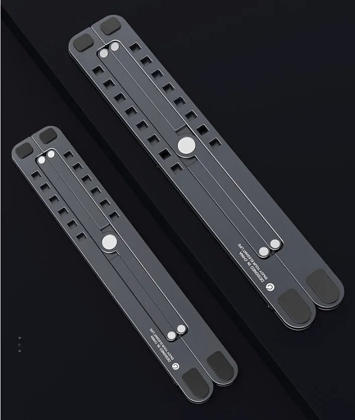 Foldable aluminium laptop stand in silver showing adjustable height mechanism and compact folded size