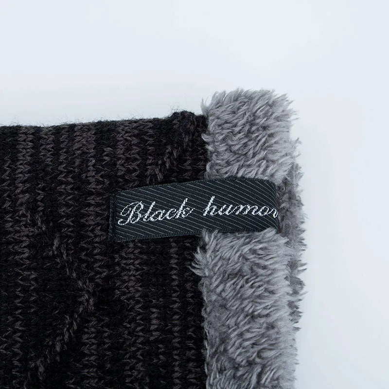 Diagonal hook knitted acrylic beanie in black, showing textured knit pattern