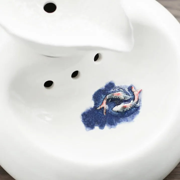 White ceramic automatic cat water dispenser with leaf-shaped bowl and pump