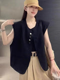Women's polyester vest in milky white or black with pocket detail and loose fit