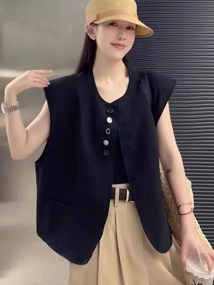 Women's polyester vest in milky white or black with pocket detail and loose fit