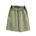 A pair of men's light blue distressed casual cotton shorts with a loose, straight-leg fit on a plain background.