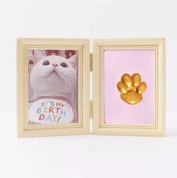 Solid wood cat palm print photo frame with gold lacquer and seal paste kit on table