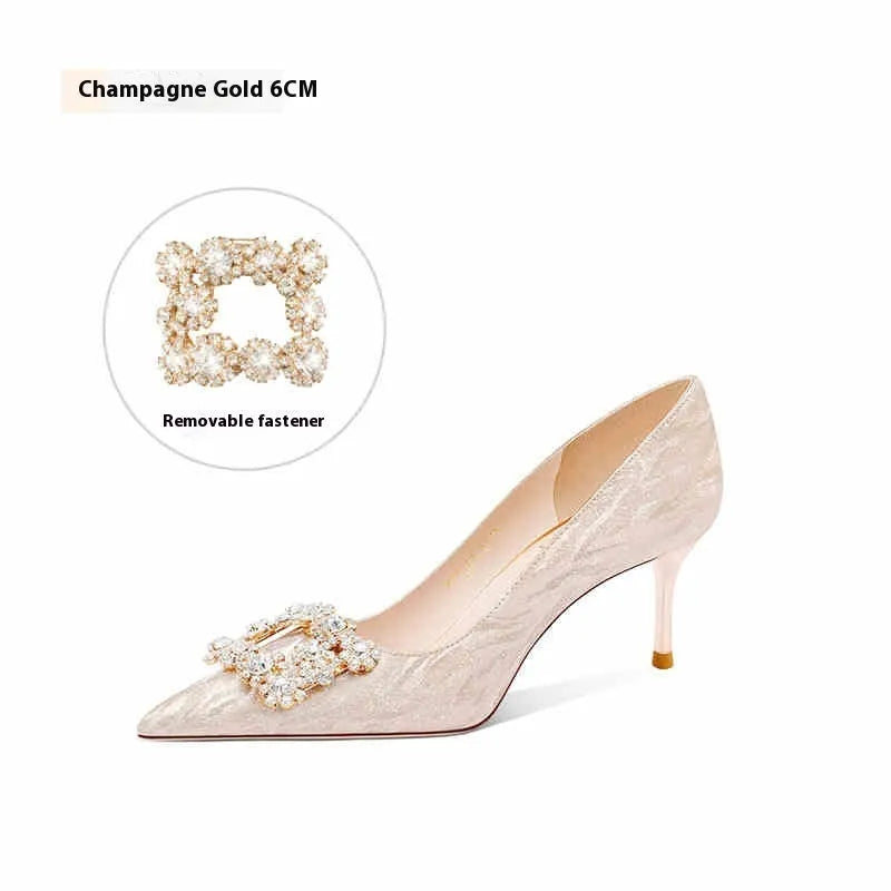 Champagne gold pointed-toe stiletto high heels with rhinestone decoration.