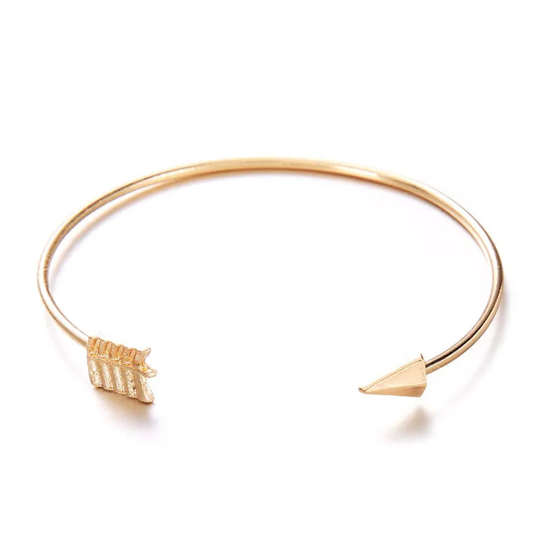 Women's gold vintage cuff bracelet with knotted arrow design in alloy with electroplated finish