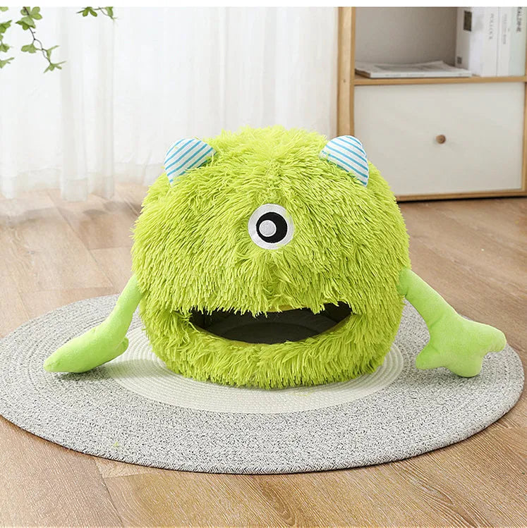 Fluffy round plush cat bed with a non-slip base, shown in a home setting.