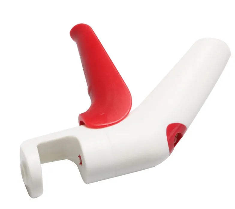 Cherry and olive pitting tool with red silicone handles and stainless steel mechanism