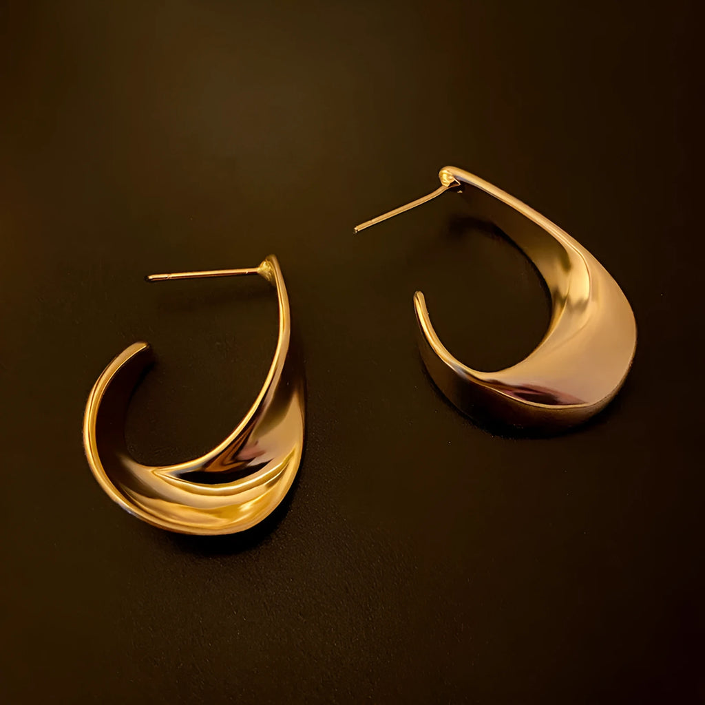 Metal geometric earrings with twisted design in gold or silver electroplated finish