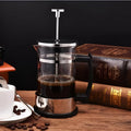 Compact glass and stainless steel coffee maker with 350ml capacity and pour-over design